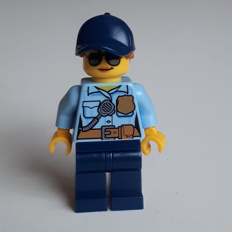 Policewoman Sam Solo, Bright Light Blue Shirt with Radio and Badge, Dark Blue Legs, Dark Blue Cap with Hair, Sunglasses