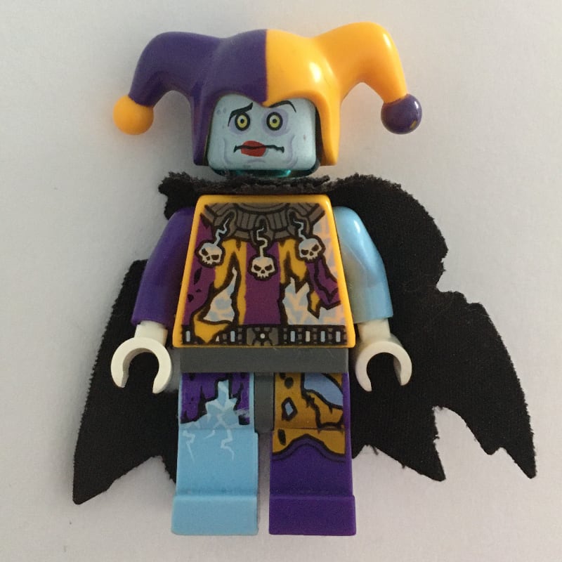 Jestro in Bright Light Orange and Dark Purple Outfit with Tattered Cape