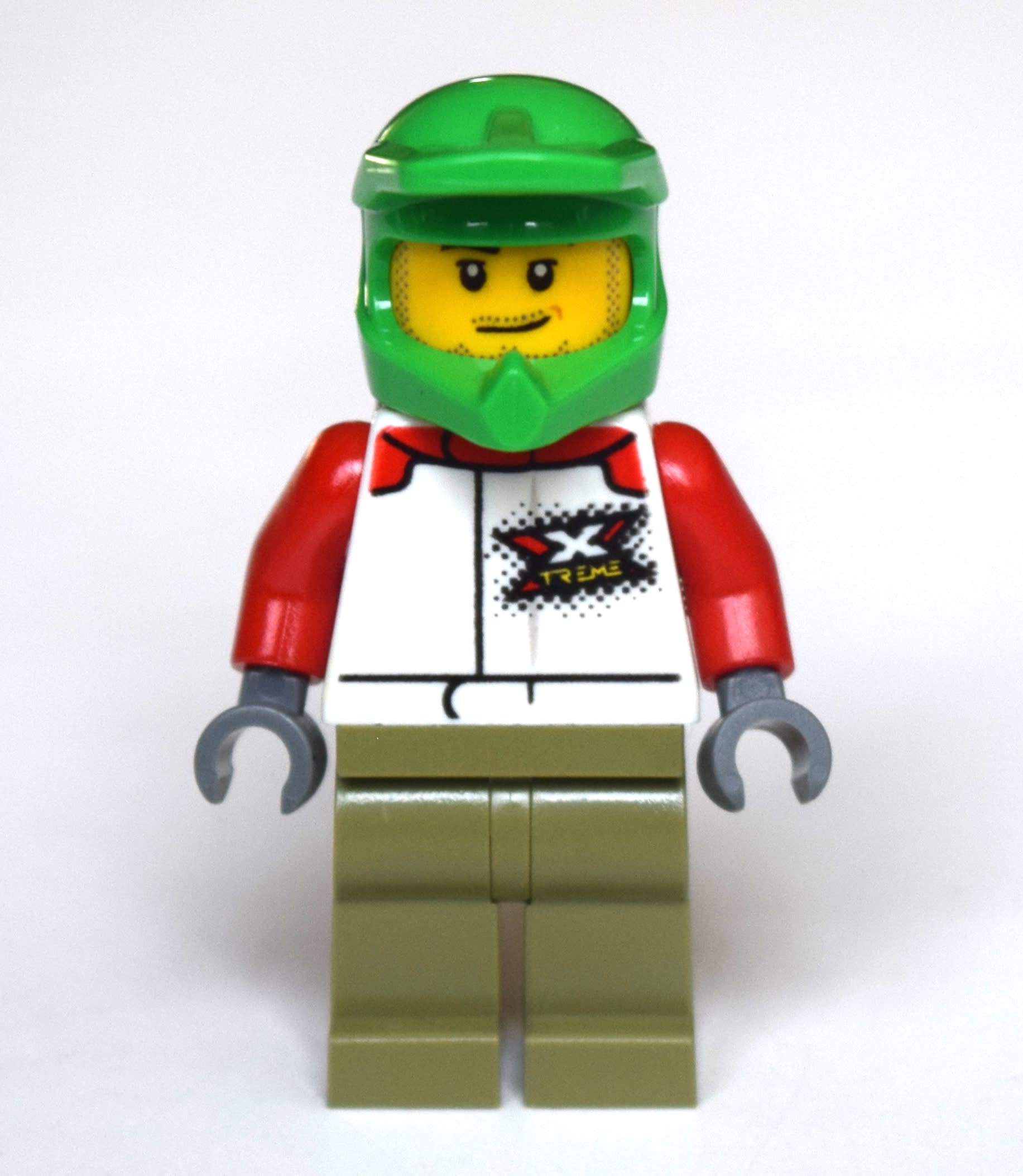Man, White Racing Jacket, Olive Green Legs, Green Dirt Bike Helmet, Stubble