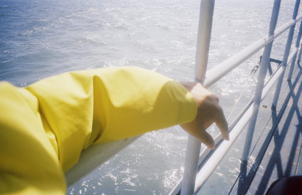 A yellow sleeve beside the boat railing