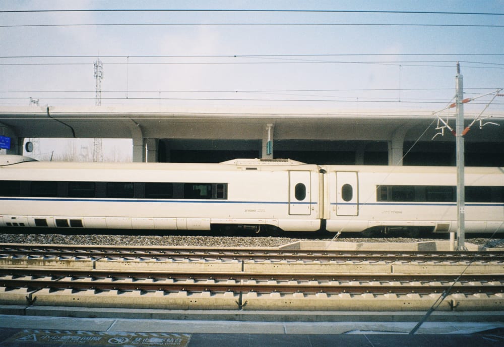 A high-speed train beside railway tracks