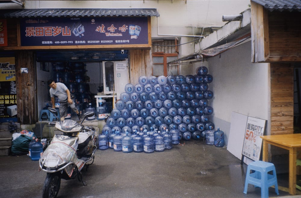 Water bottles stacked outside a shop