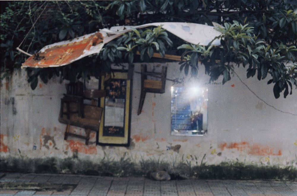 Sunlight reflected by a mirror on a weathered wall