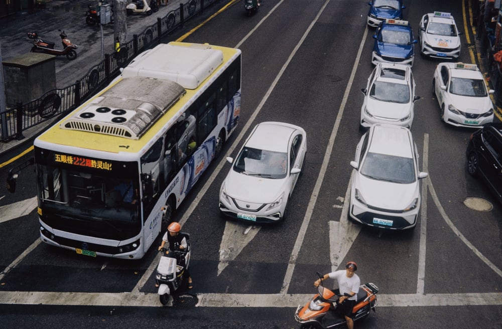Buses, cars and scooters seen from above