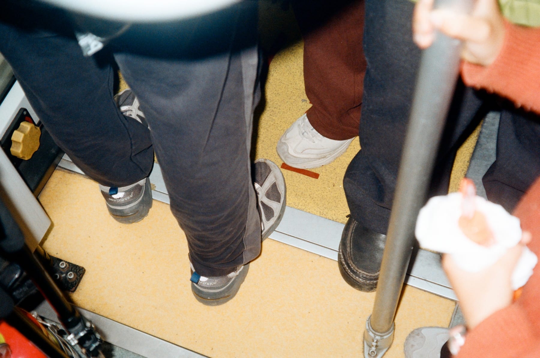 Passengers standing inside a bus