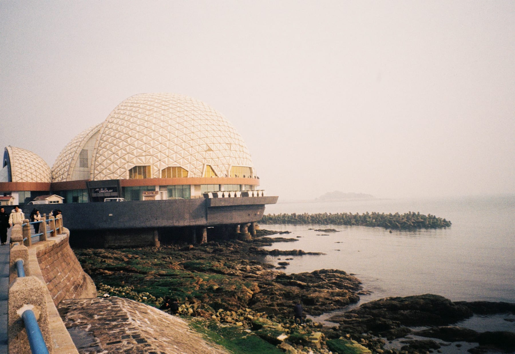 A domed building on the coastline