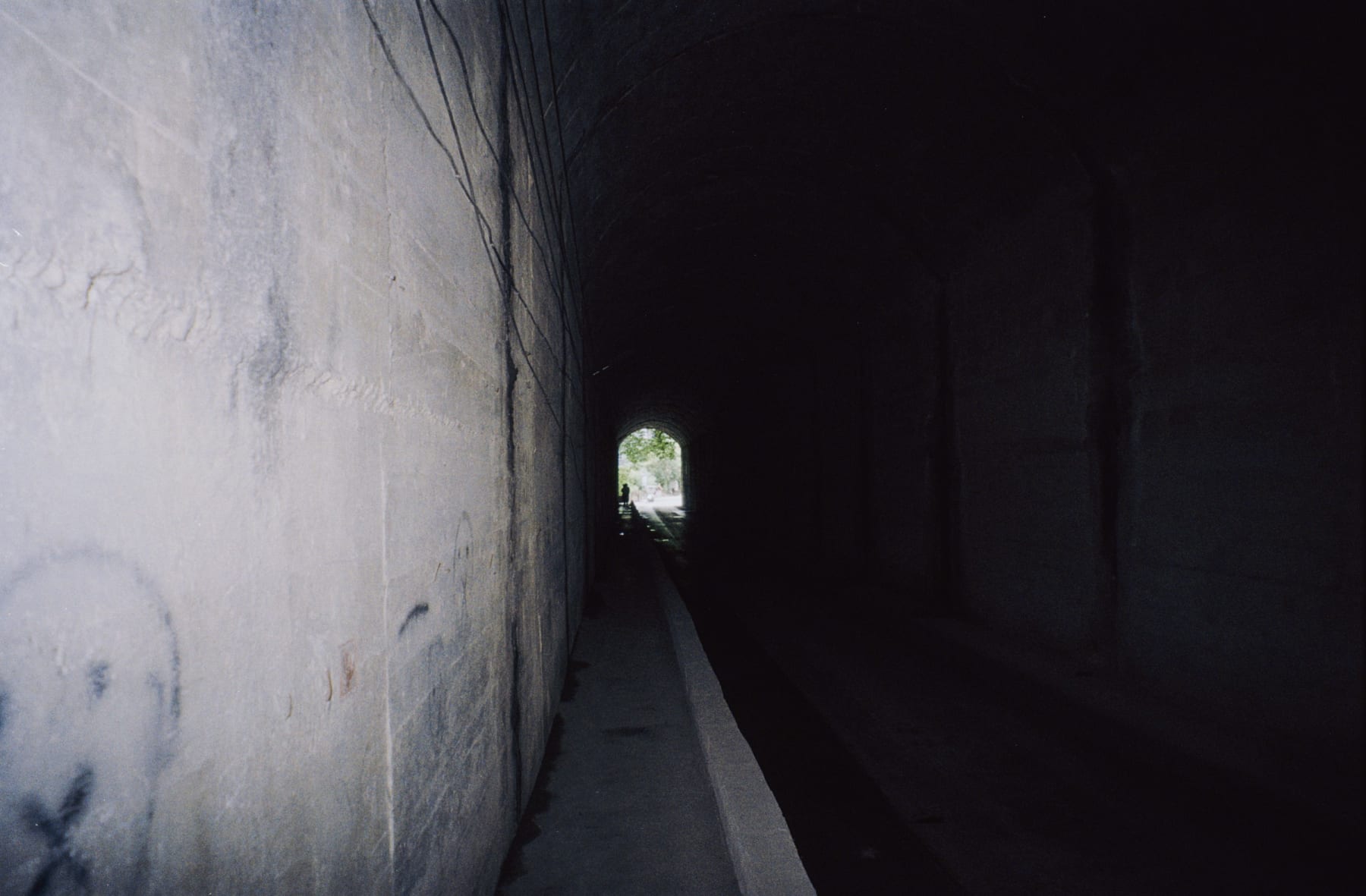 Light at the far end of a dark stone passage