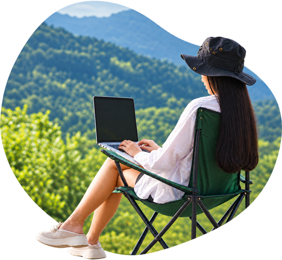 Woman working on a laptop outdoors