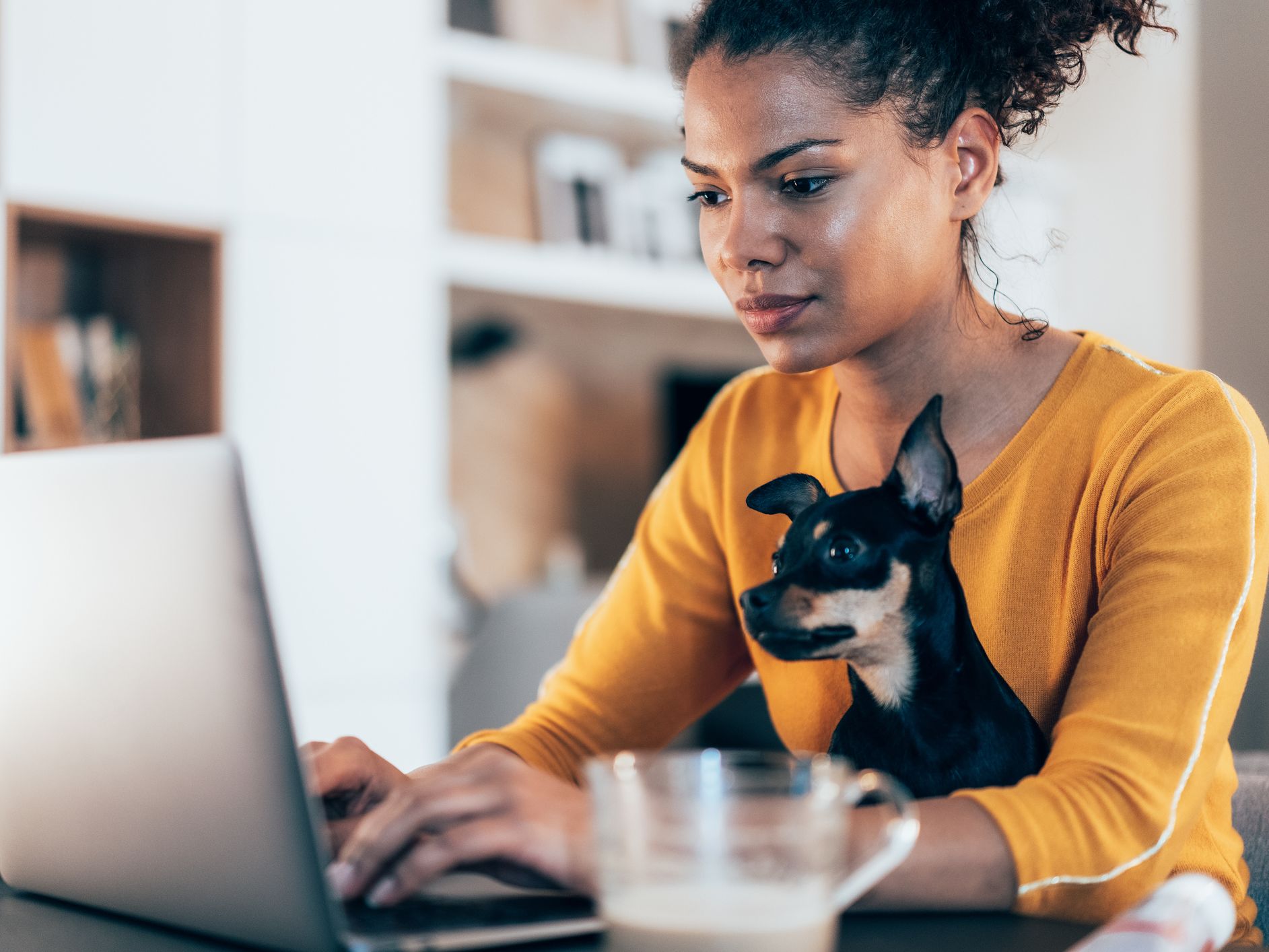 Image of a woman working from home.