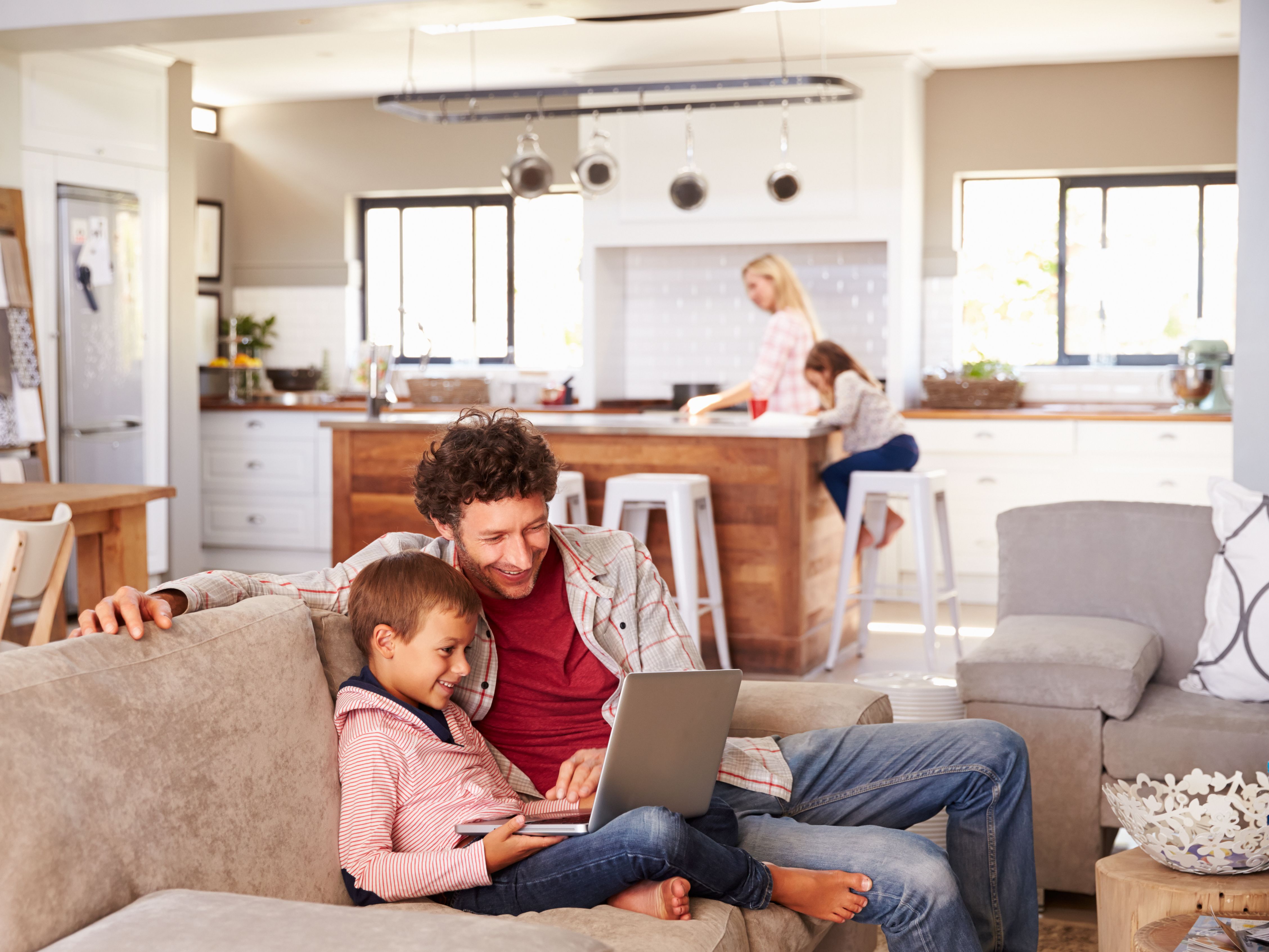 Image of a family hanging out in their house.