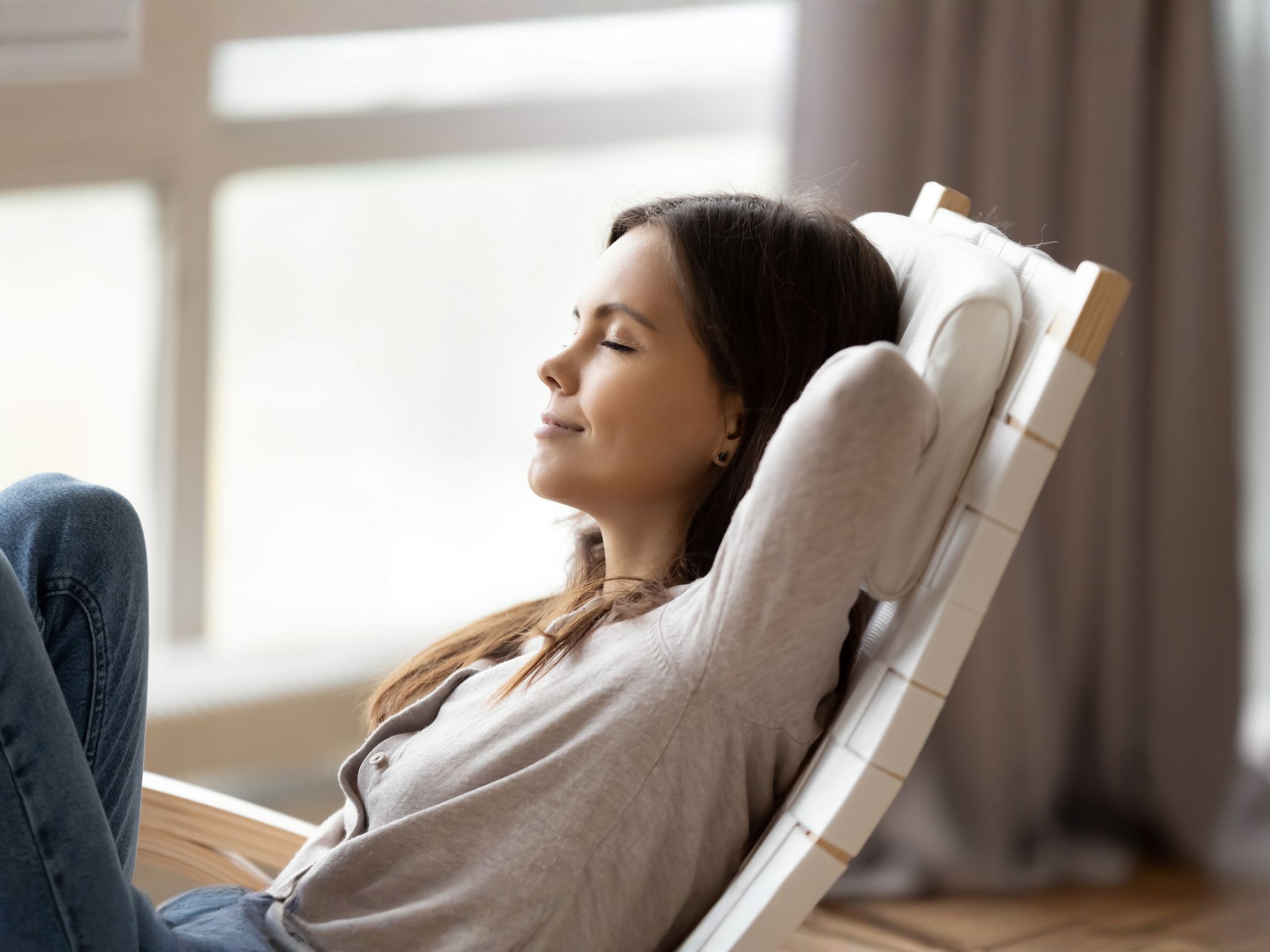 Woman relaxing in a chair peacefully.