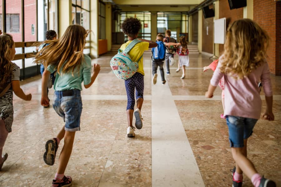 Children running down hallway