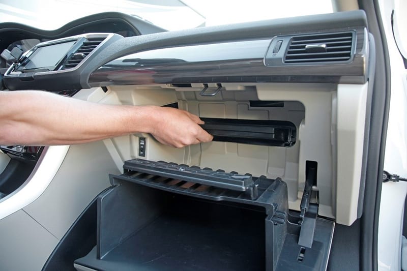 Installing a cabin air filter behind glove box