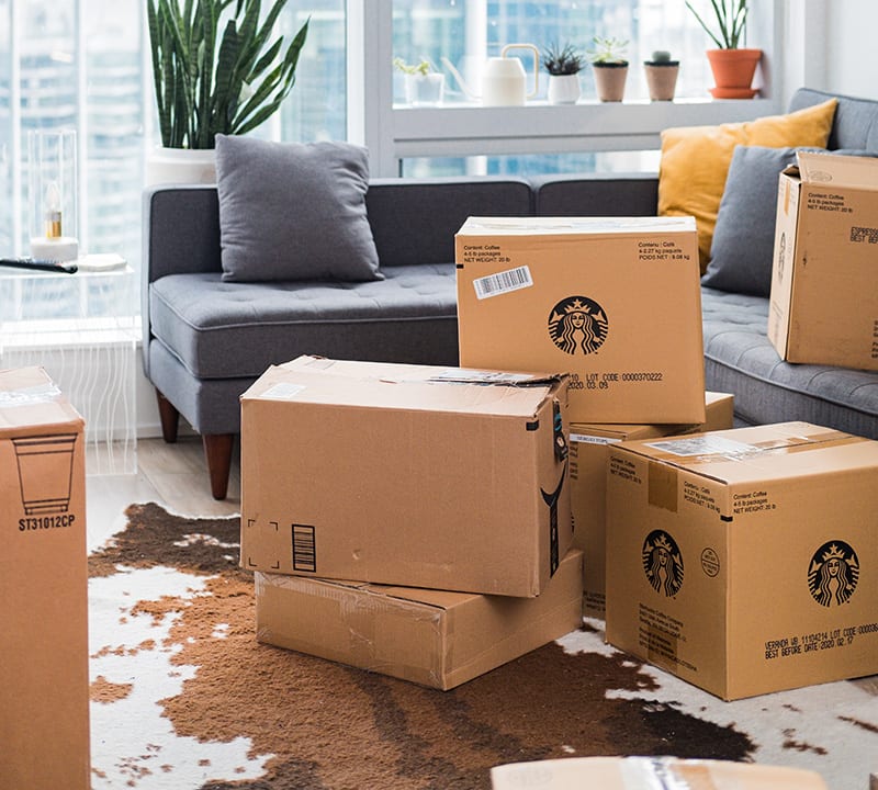Consolidate your online orders Cardboard boxes in living room
