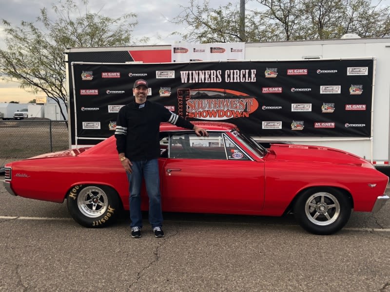 Jonathan Fiello with his Chevrolet Malibu Man posing with Chevrolet Malibu racecar