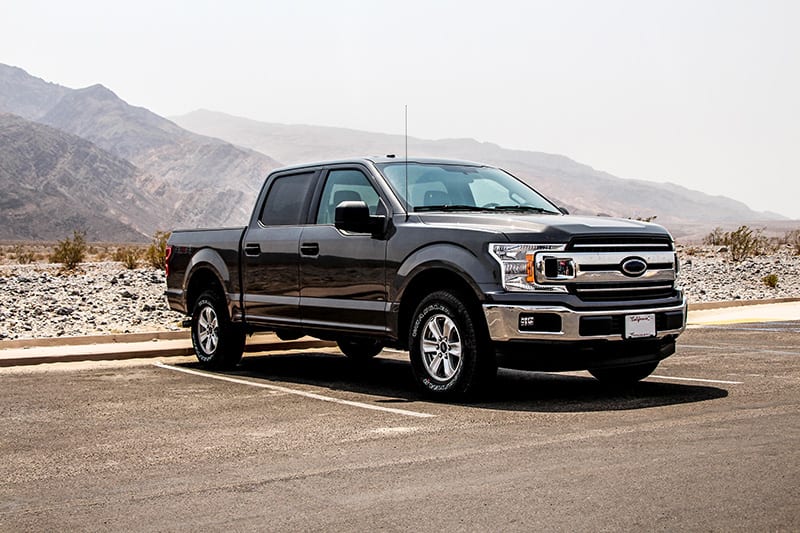 Black Ford F150 parked in the desert