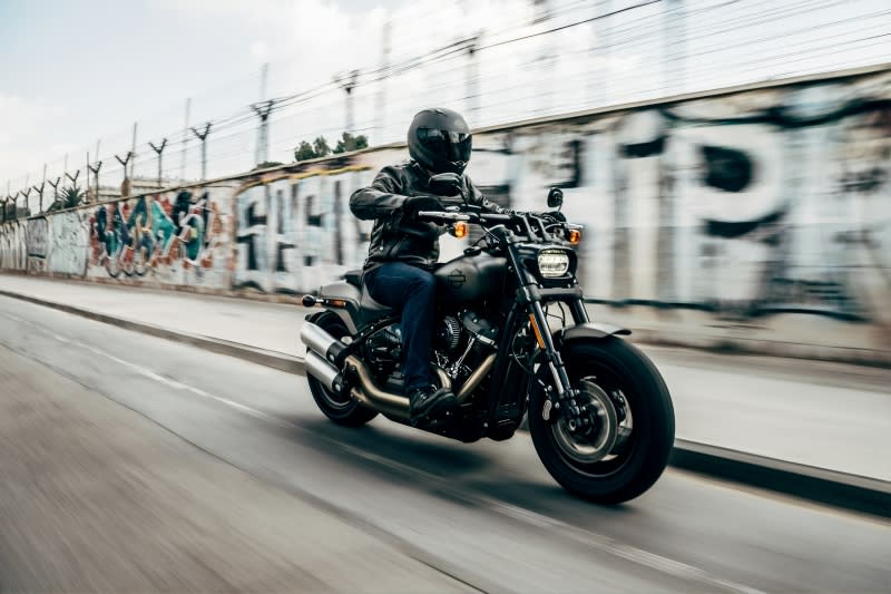 Man riding Harley Davidson motorcycle on the highway