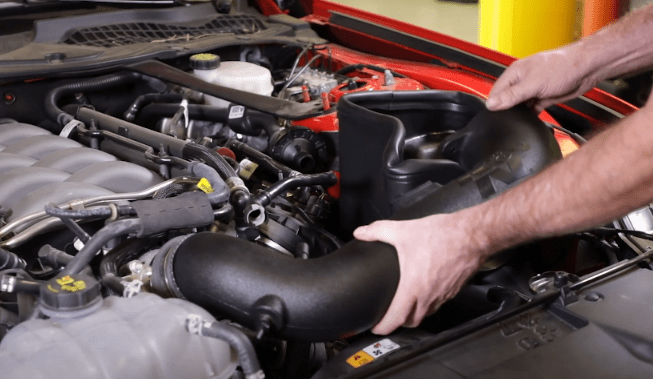 Attaching the new K&N intake tube Attaching the new K&N intake tube