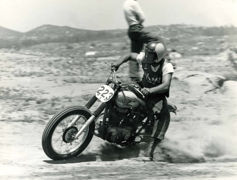 Norm McDonald racing in the 1960s Man riding vintage motorcycle