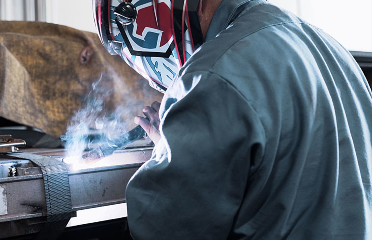 The captivating image showcases a Level 2 Body Technician at Swift Transportation confidently welding a frame. With protective gear and precision equipment, the technician skillfully operates the welding torch, producing sparks that illuminate the scene. Their expertise and attention to detail are evident as they meticulously reinforce the frame, ensuring structural integrity and safety. This snapshot exemplifies Swift Transportation's commitment to maintaining top-notch equipment and highlights the specialized skills of their Level 2 Body Technicians in delivering high-quality repairs and maintenance services.