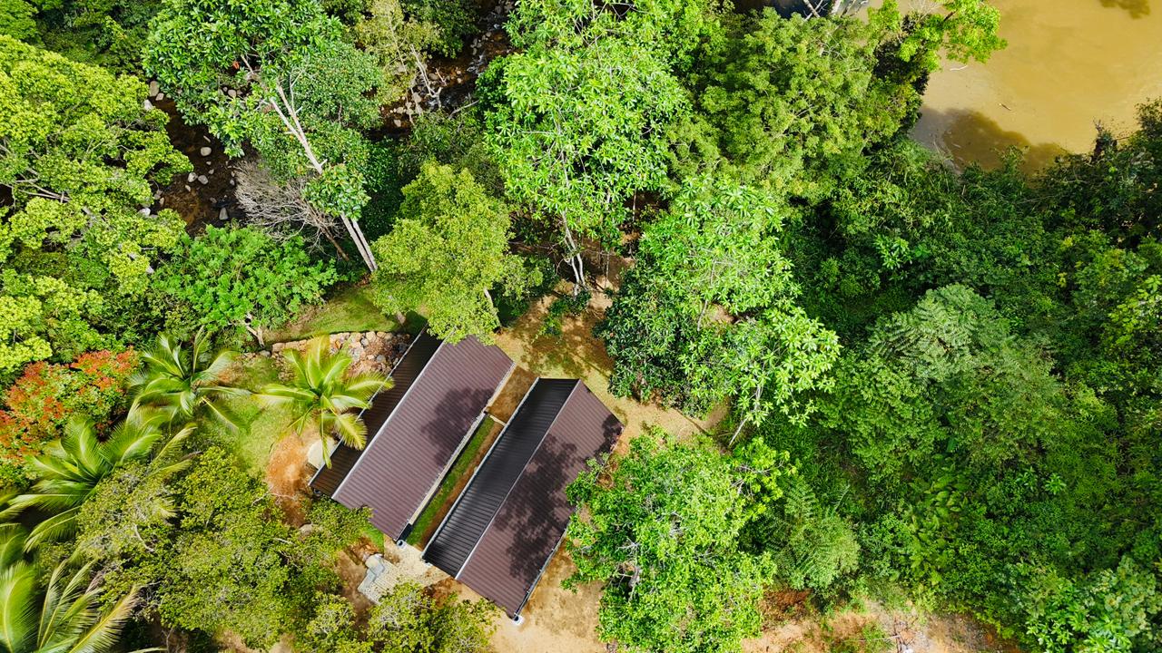 Aerial drone view of misty Sinharaja forest and Gin River