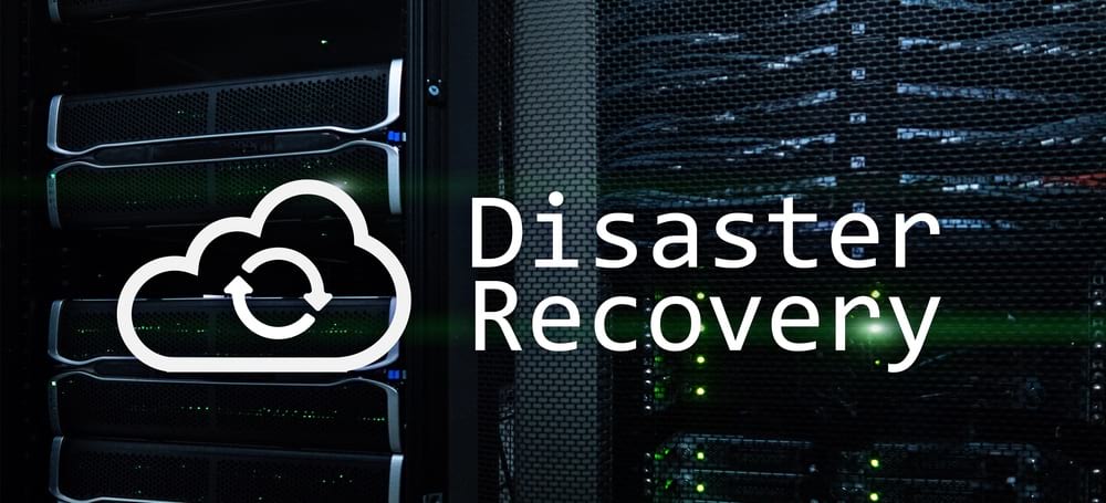 Disaster Recovery written in the middle of the picture with a cloud on the left and servers at the back