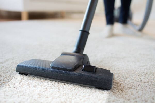 vacuuming carpet