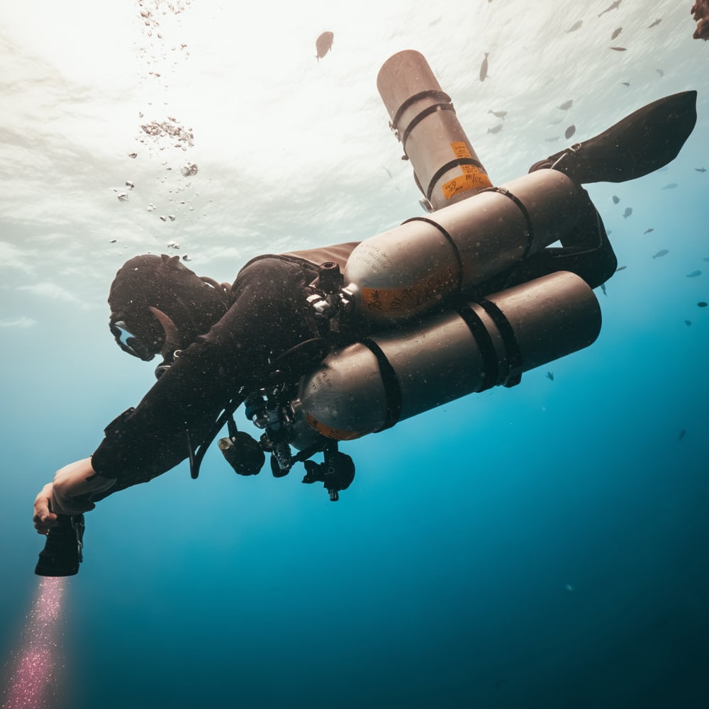 Koh tao diver conducting technical dive in open water with multiple tanks.