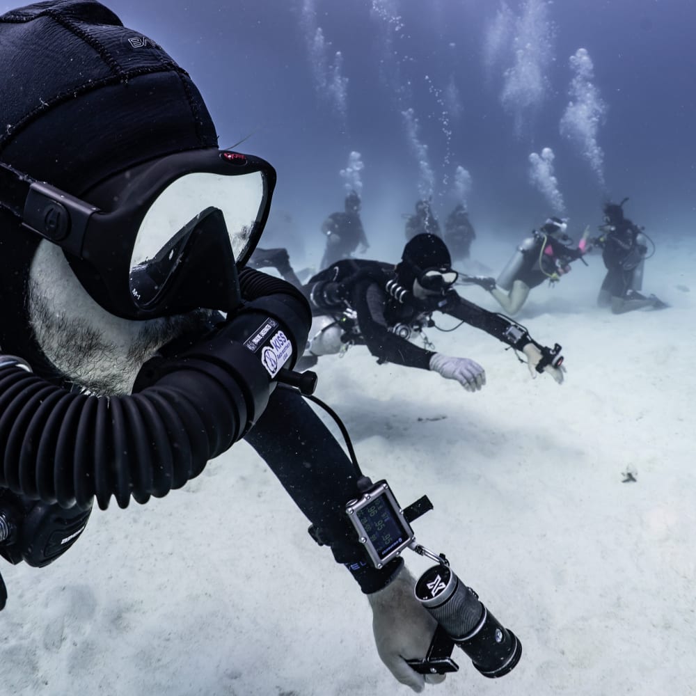 Koh Tao Divers practicing team skills on the ocean floor with full CCR sidemount configuration