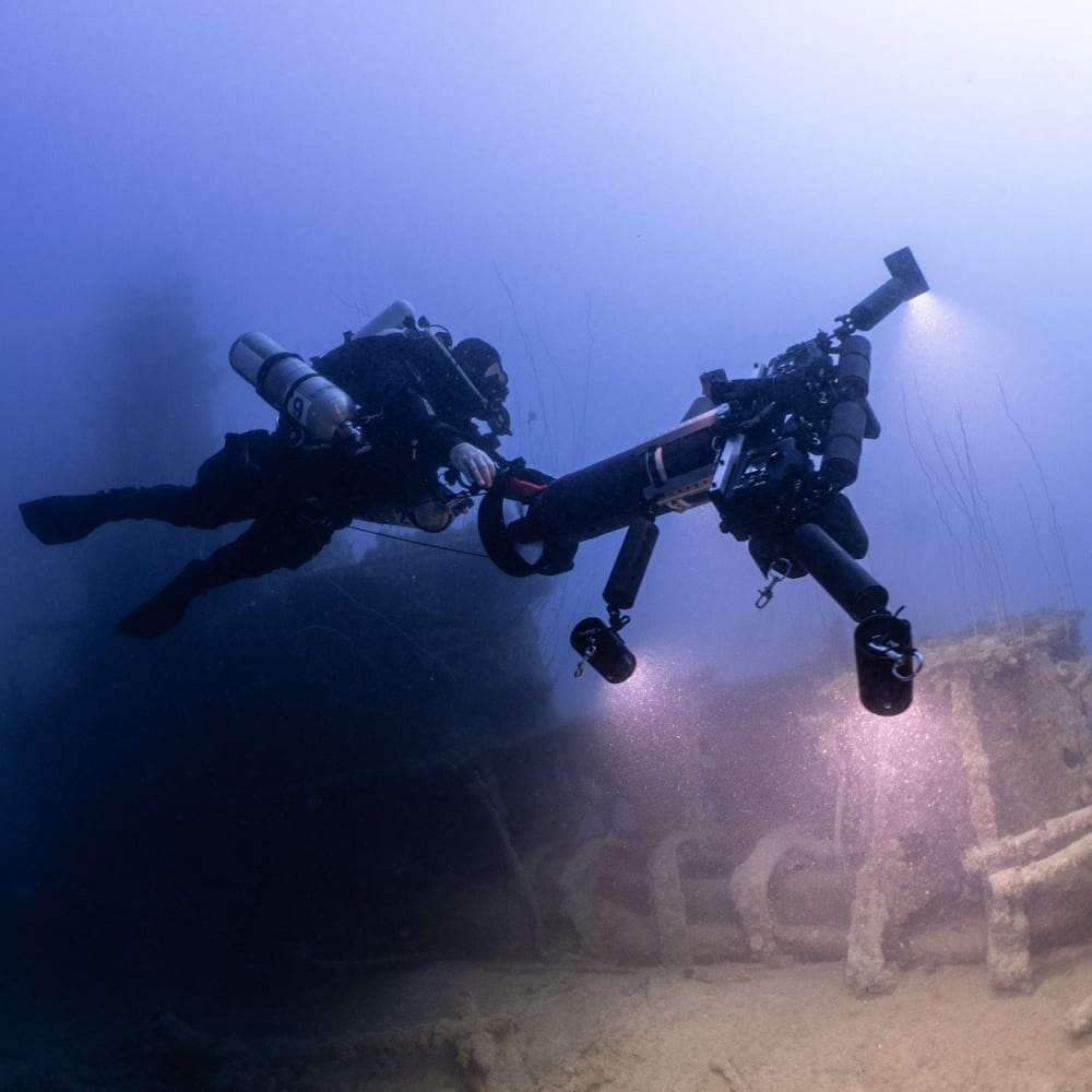Koh Tao Divers rebreather diving next to a shipwreck with underwater camera