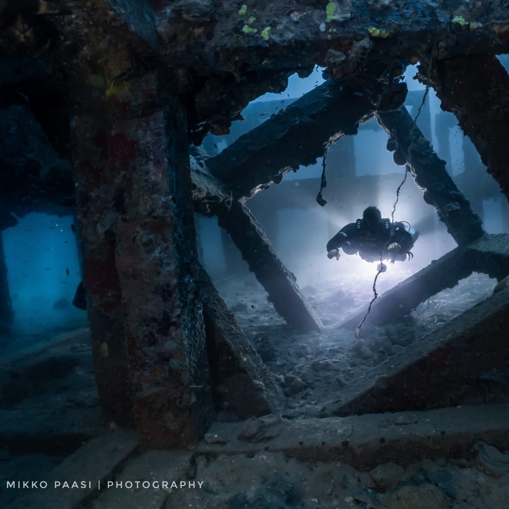 Koh Tao Divers rebreather diver navigating narrow underwater structures during CCR training