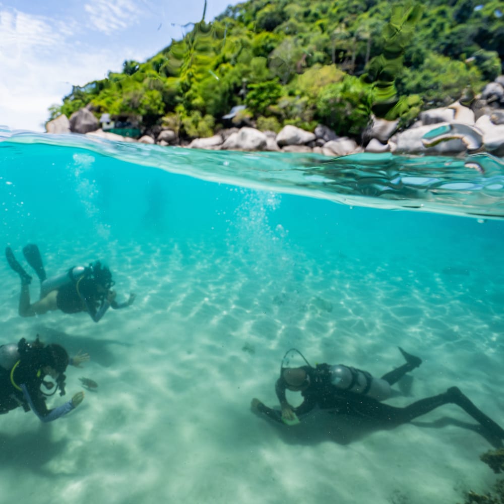 Koh Tao Divers instructors preparing dive gear during Divemaster workshop