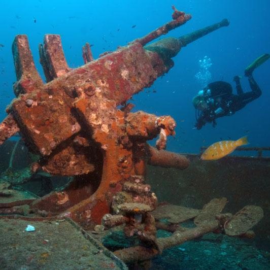 Koh tao divers in wreck penetration dive