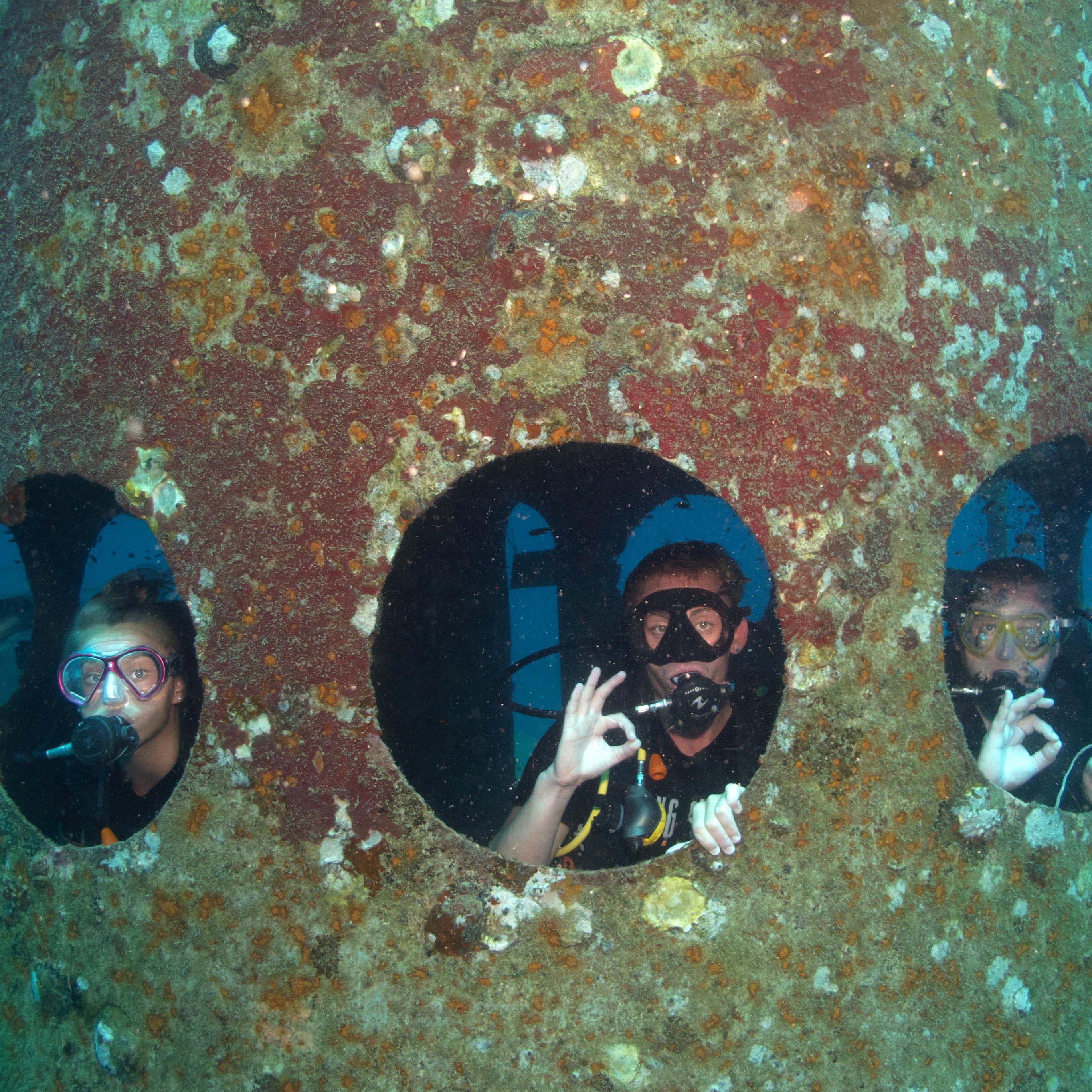 Koh Tao Divers diver meditating inside a square underwater metal frame