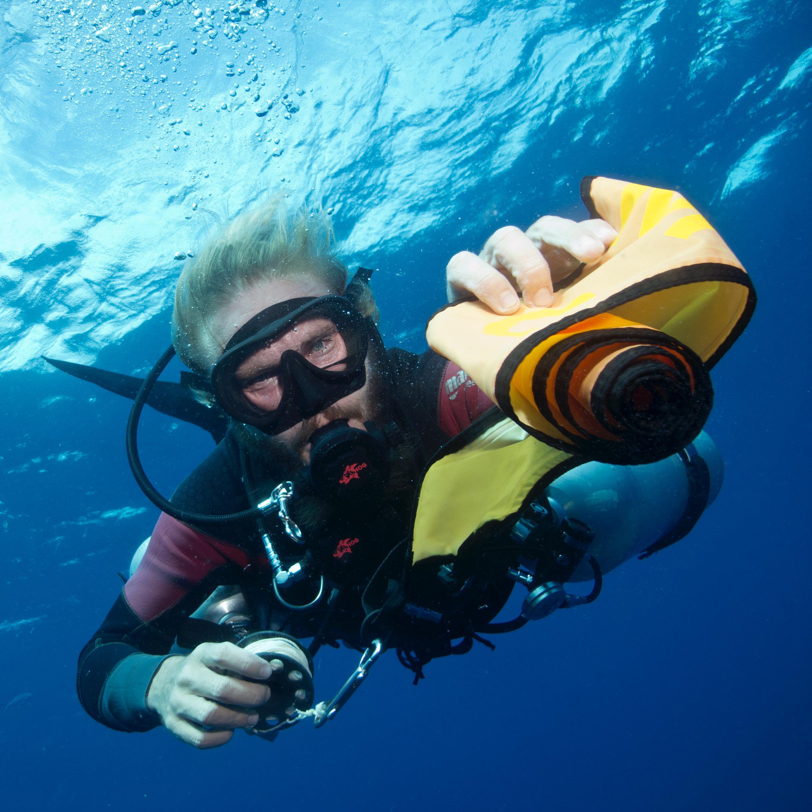 Koh Tao Divers a diver ready to fill smb