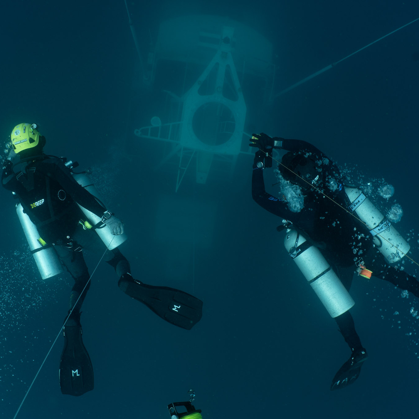 Koh Tao Divers divers practicing penetration techniques inside the HTMS Sattakut’s hull