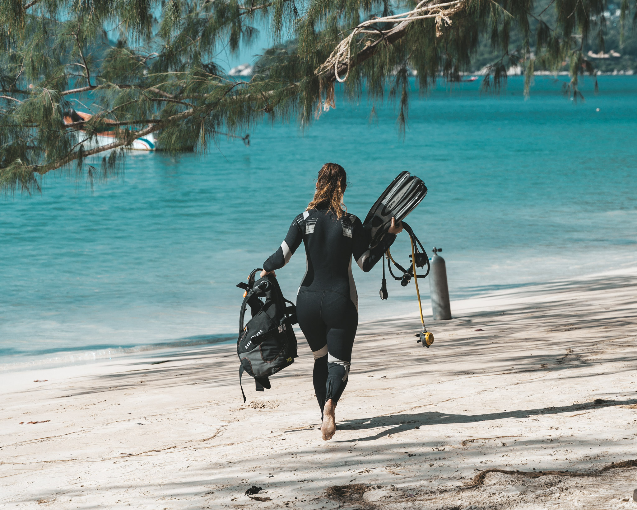 Koh Tao Divers instructor walking on the beach