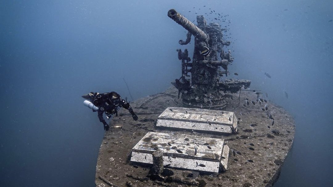Koh Tao Divers technical diver exploring the bow gun of the HTMS Sattakut wreck