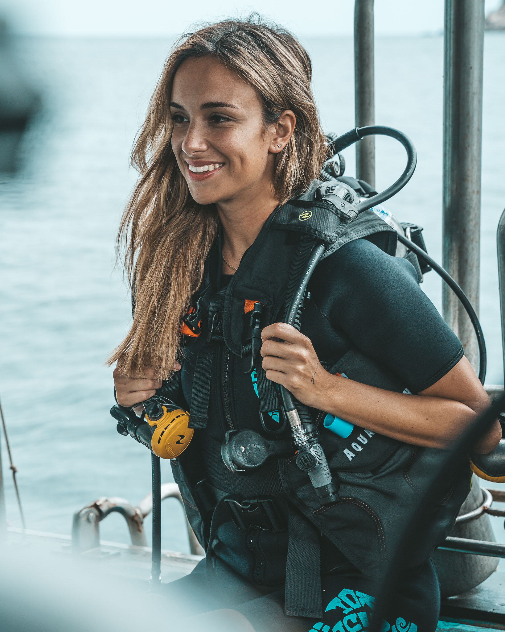 Koh Tao Divers A female diver smiles beautifully on a boat