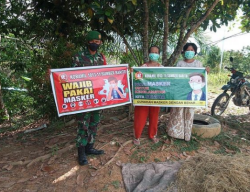 Babinsa Koramil 1013-11/Sumber Barito Ajak Warga Gunakan Masker Guna Menekan Penyebaran Covid-19.