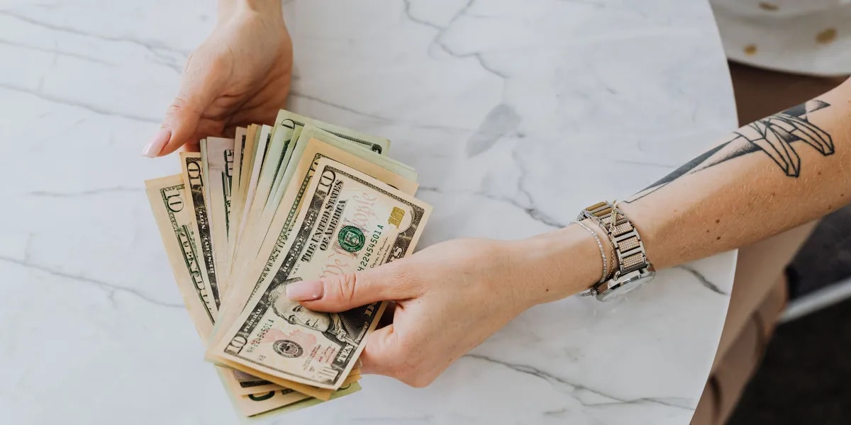 A Woman's Mom Made Her Start Working at 16 and Give Half of Every Paycheck to Her Younger Cousin – After Her Mom Passed Away, the Cousin Handed Her a Suitcase and Said, 'She Told Me to Give You This Only After Her Funeral