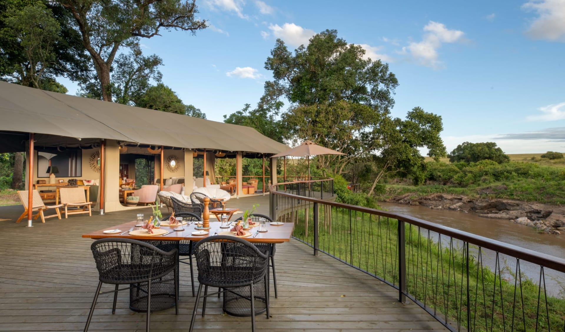 Rekero Camp in Masai Mara:  Communal Dining Setup on Deck with river view