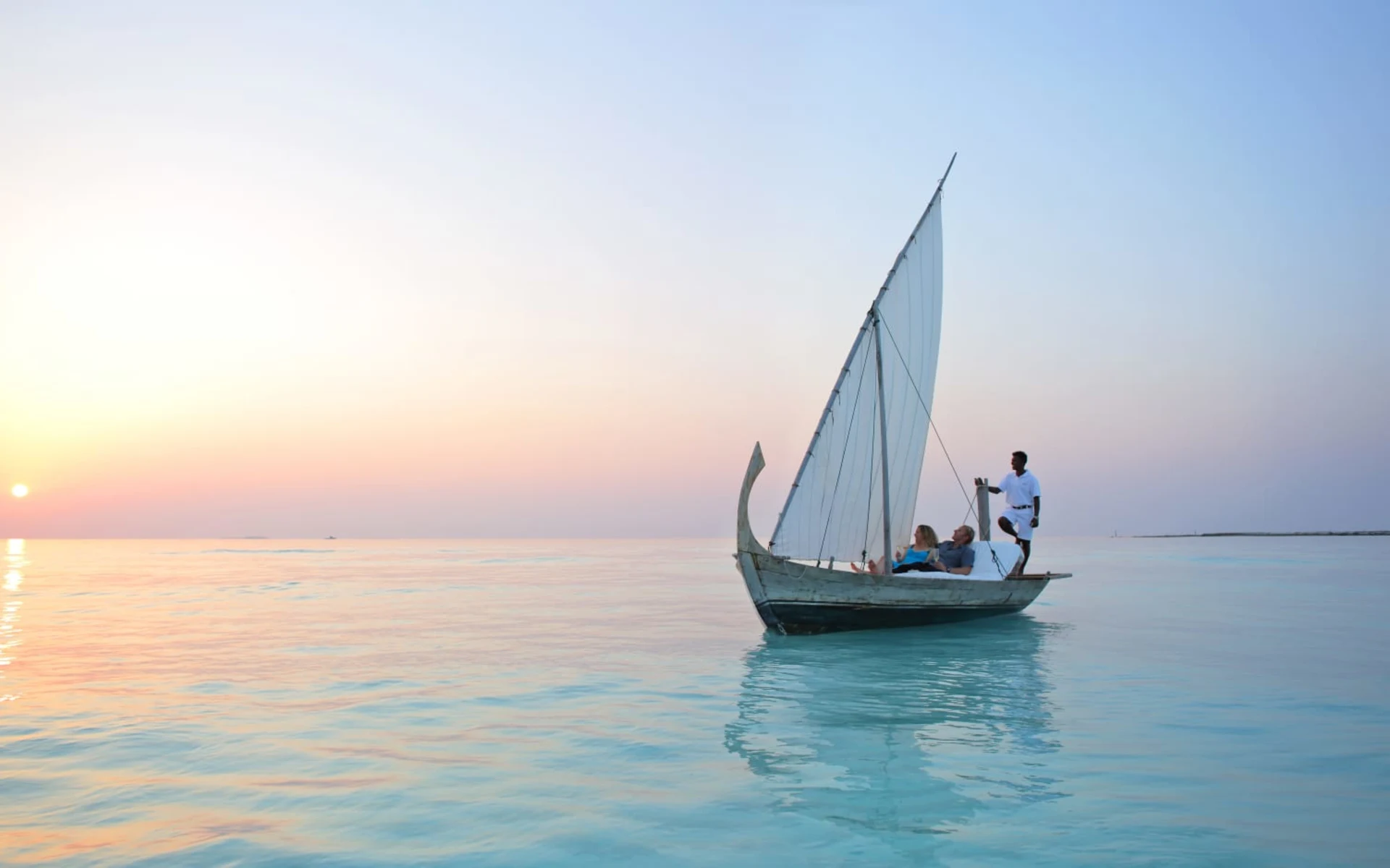 Gili Lankanfushi Maldives in Nordmale-Atoll: Sunset Sailing on Traditional Dhoni_Landscape Gili Lankanfushi Maldives in Nordmale-Atoll: Sunset Sailing on Traditional Dhoni_Landscape