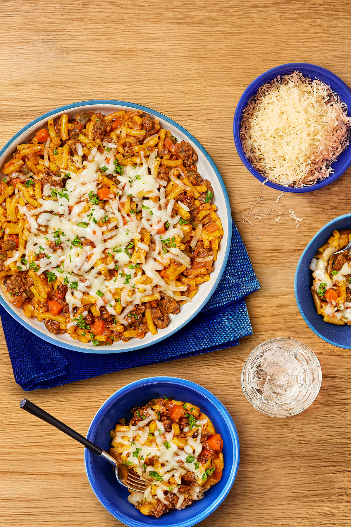 A top-down view of a delicious, cheesy one-pan bolognese macaroni and cheese dish. 