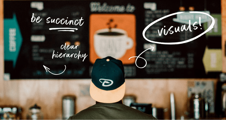 Person wearing a cap staring at menu board