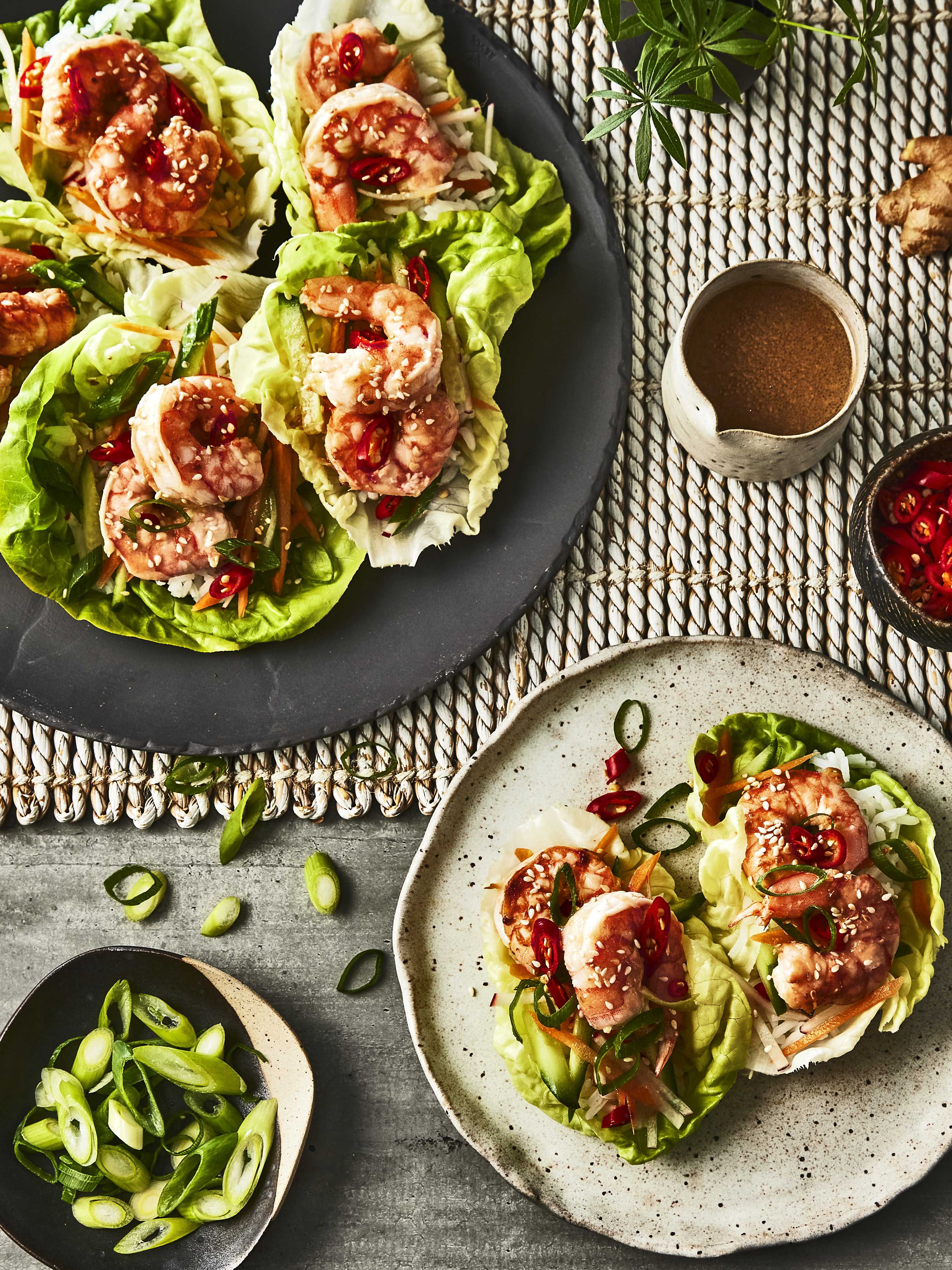 A plate filled with appetizing Miso Lime Ginger Shrimp Lettuce Wraps, an easy lunch recipe made with Pure by J.L. Kraft Dressings.