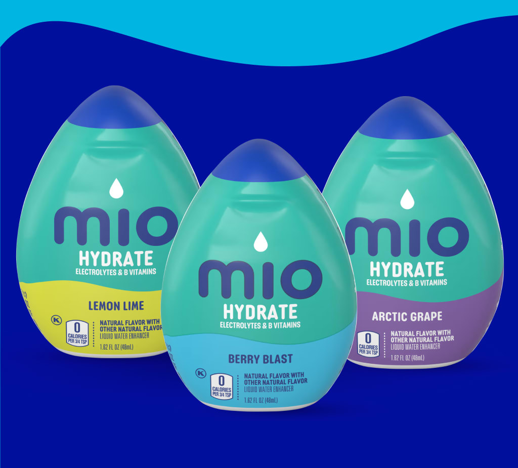 Three bottles of Mio Hydrate liquid water enhancer in Lemon Lime, Berry Blast, and Arctic Grape flavors