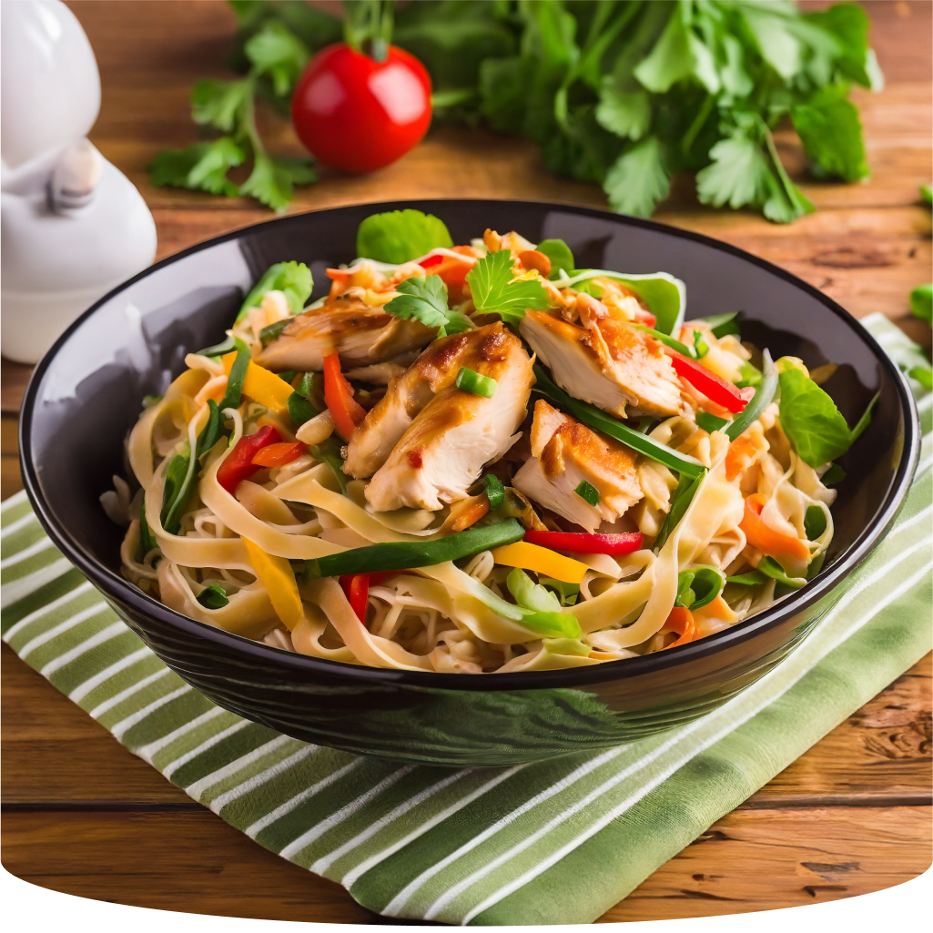Bowl of chicken noodles and vegetables.