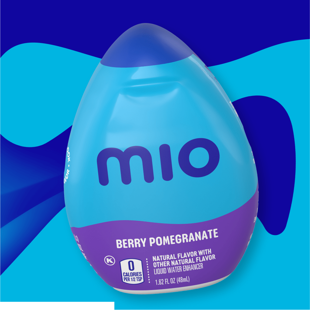 A bottle of Berry Pomegranate MIO liquid water enhancer with a blue background. The bottle is primarily blue with a purple ba