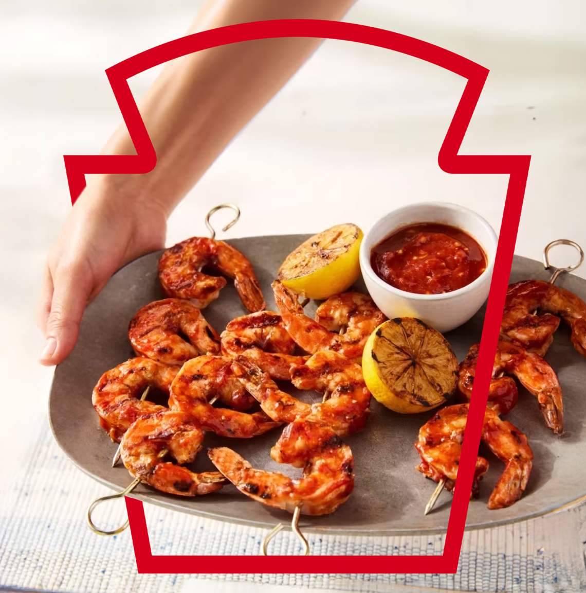 Grilled garlic lemon shrimp kabobs served with a side of Heinz Chili Sauce for dipping.